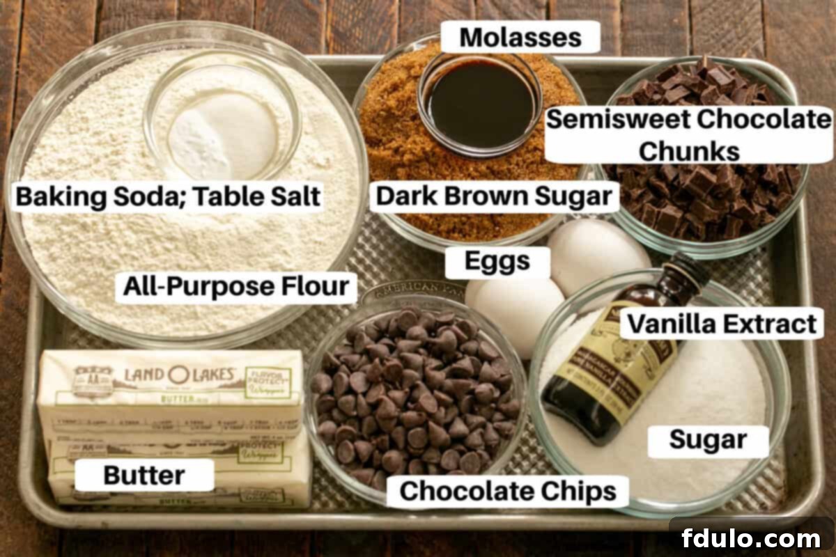 Colossal Chocolate Chip Cookies 2 All the ingredients for jumbo chocolate chip cookies laid out on a metal sheet pan, clearly labeled and ready for baking.