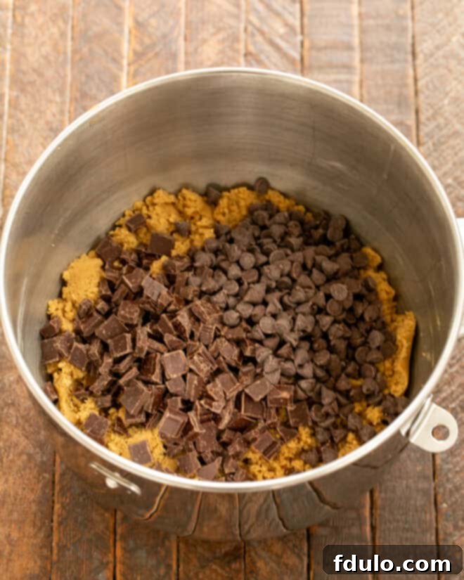 Colossal Chocolate Chip Cookies 7 Add chocolate chips and chunks to the cookie dough.