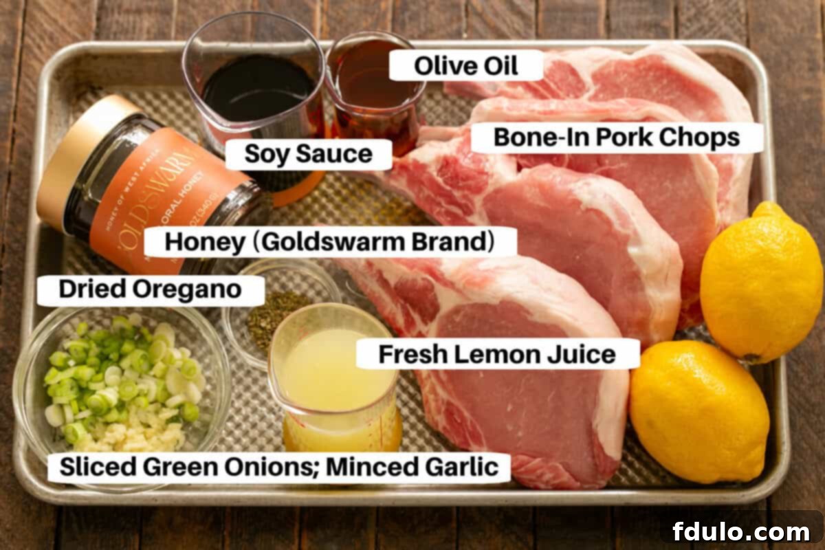 Soy, Honey & Lemon Marinated Pork Ingredients with labels on a sheetpan.