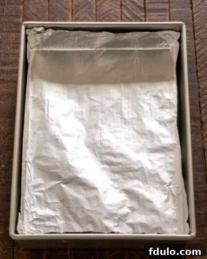 Pan lined with nonstick foil, ready for the crust.