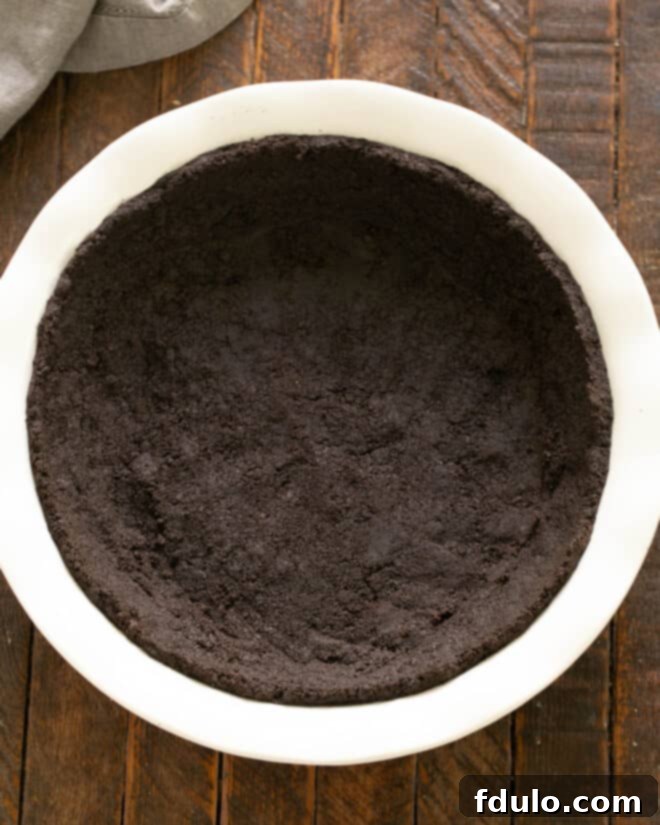 Step 1: Make cookie crust by mixing crumbs, butter, and sugar, then pressing into a pie plate.