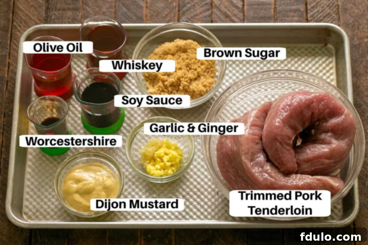 Whiskey Marinated Pork Tenderloin Ingredients with labels on a metal sheetpan.