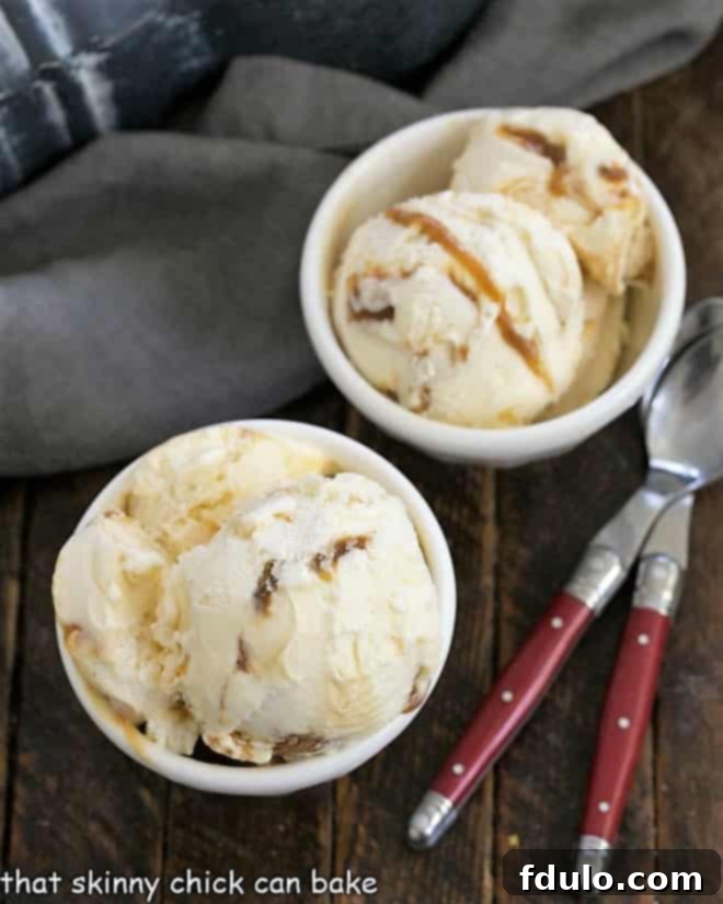 Overhead view of two small white bowls, one filled with smooth caramel sauce and the other with Homemade Vanilla Caramel Swirl Ice Cream.