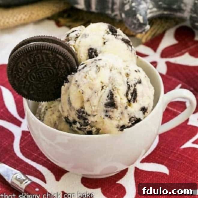 Homemade Oreo ice cream with visible crushed cookie pieces throughout a creamy white base.