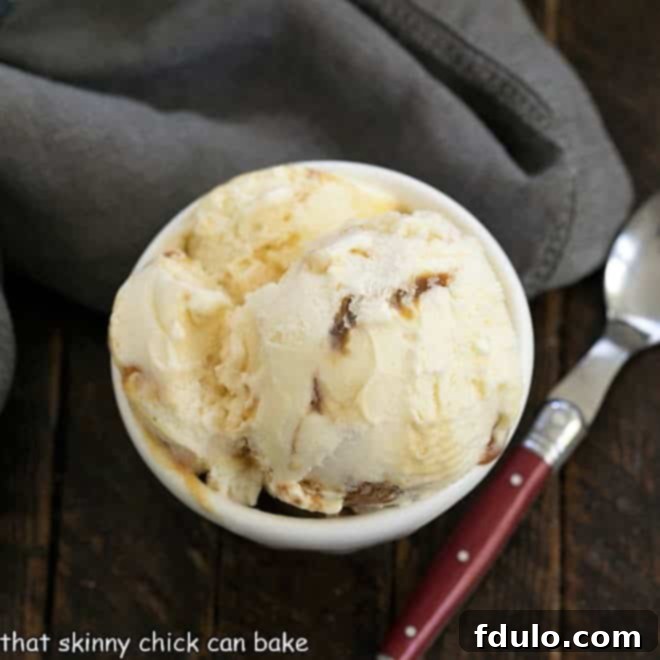 Swirls of golden caramel sauce mixed into creamy vanilla ice cream.