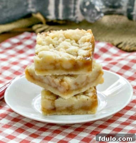 Caramel Butter Bars - Simple flavors with delicious results! Caramel Butter Bars stacked on a small, white round plate
