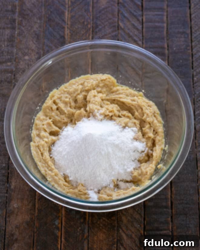 Ultimate Oreo Chocolate Chip Bars 5 Step 3: Incorporating the instant vanilla pudding mix.