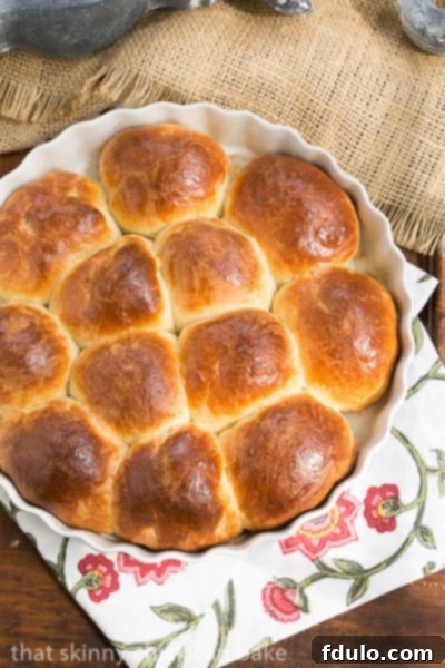 Brioche Dinner Rolls in a white ceramic baking dish.