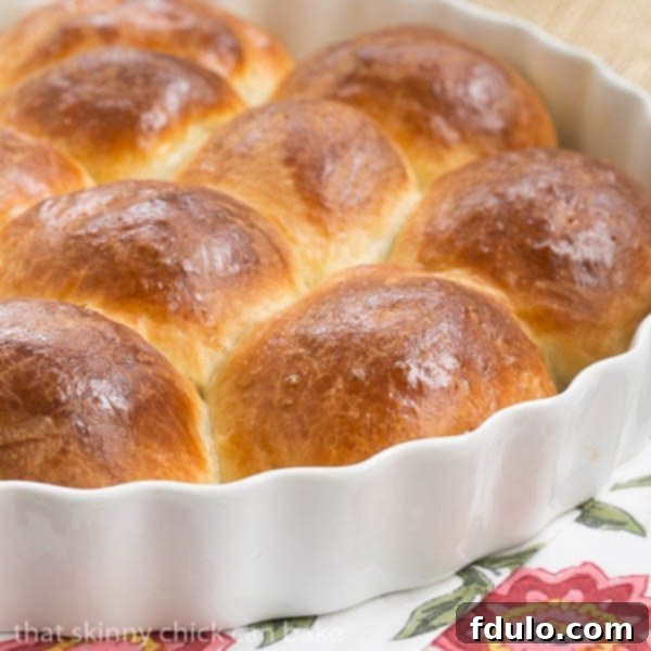 Brioche Dinner Rolls in a white ceramic dish.