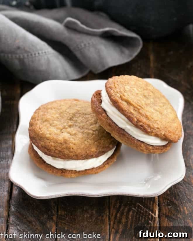Sweet Cream Filled Oatmeal Cookies 3 One oatmeal creme pie leaning on another on a square white plate