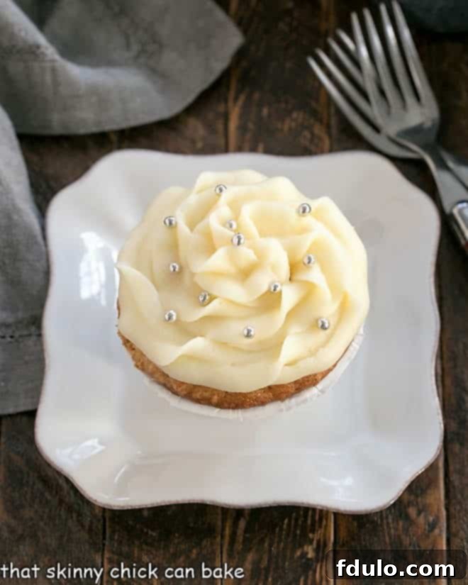 Overhead view of an Easy Vanilla Cupcake on a white plate