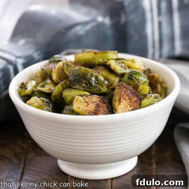 Honey Balsamic Glazed Brussels Sprouts 2 Roasted Brussels sprouts in a white ceramic bowl
