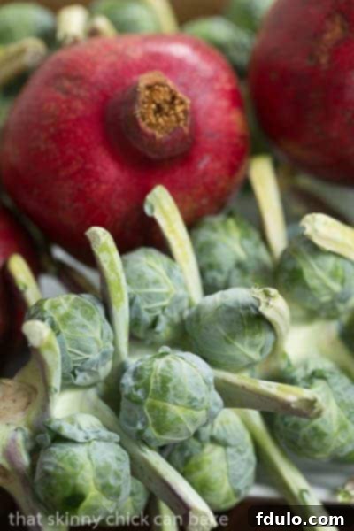 Fresh Brussels sprouts to be roasted Brussels Sprouts on the stalk, showcasing their freshness.