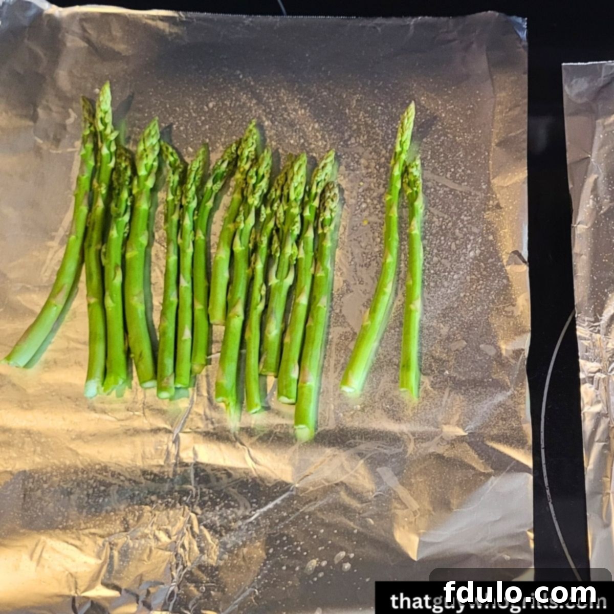 Trimmed asparagus on Tin Foil