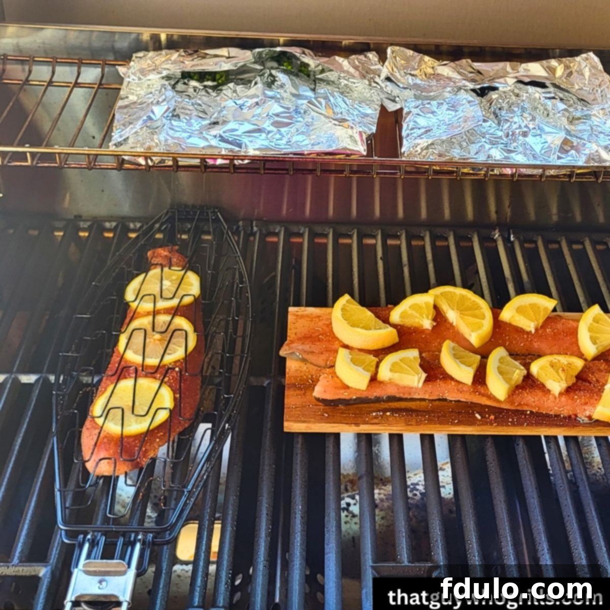 Grilled Asparagus foil packets grilling with salmon on a Monument Grills gas grill