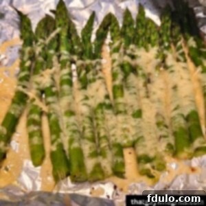 Cheesy Grilled Asparagus on tin foil cooked
