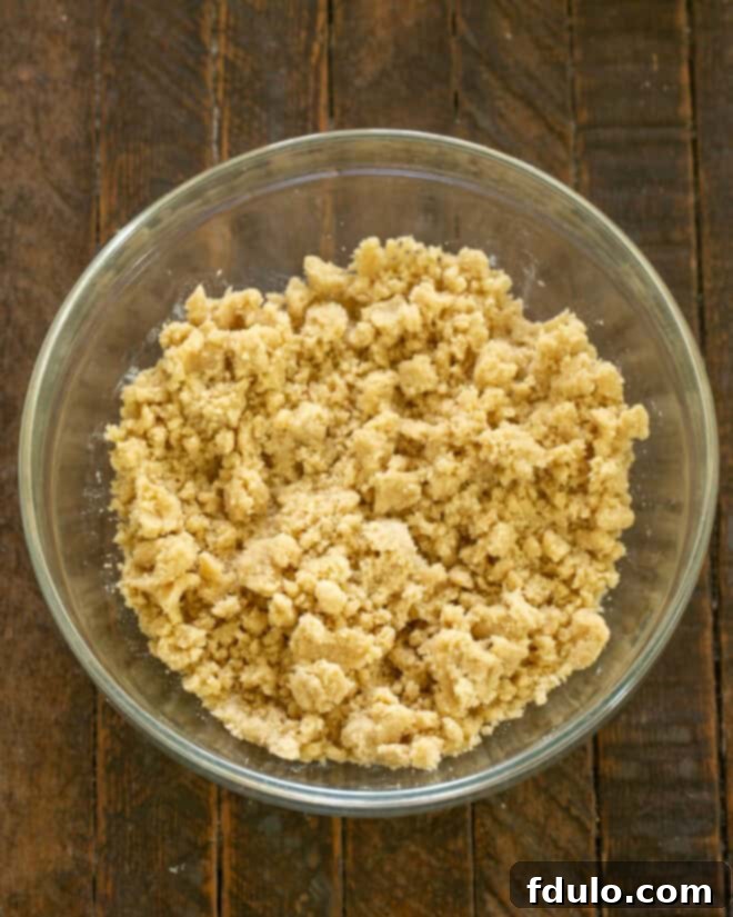 Apple crisp topping ingredients mixed into a crumbly texture.