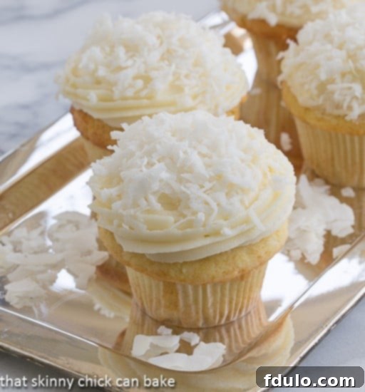 Coconut Cupcakes with Cream Cheese Frosting | An irresistible tropical treat for coconut fans.