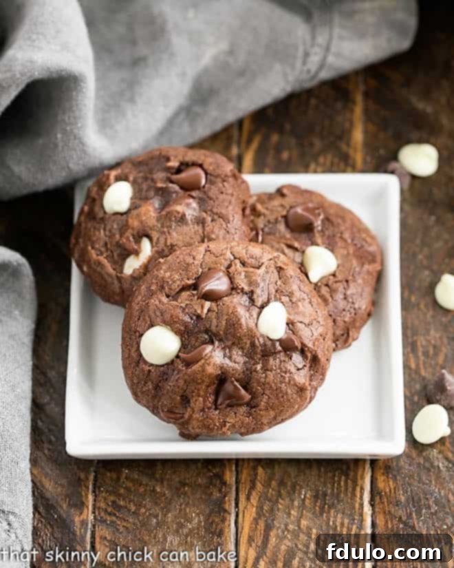 The Ultimate Cookie Recipe Collection 3 Chewy Brownie Cookies with dark and white chocolate chips.