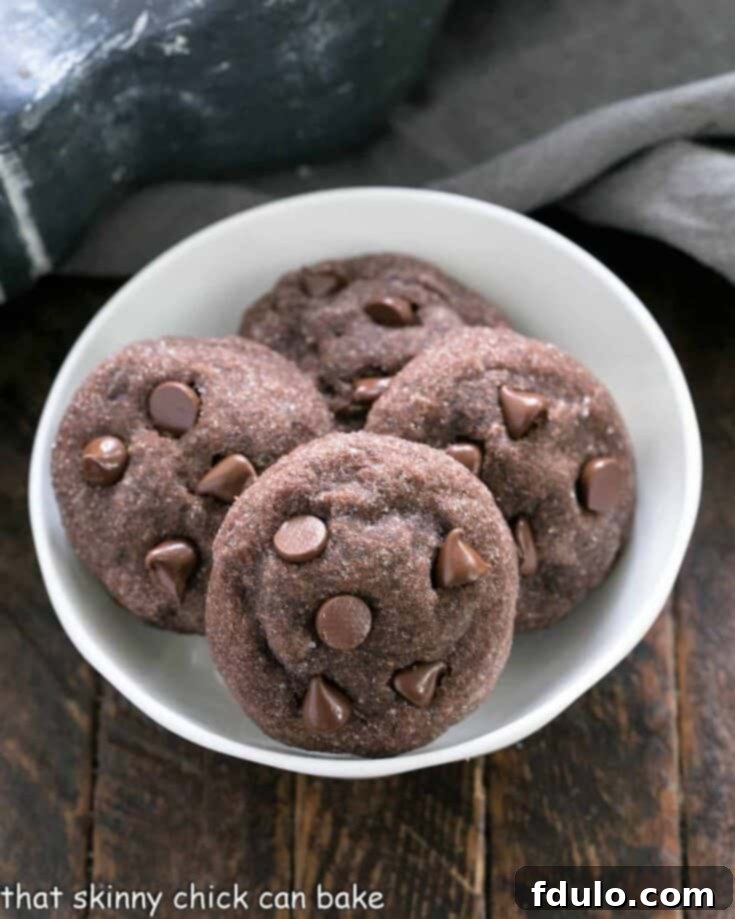 The Ultimate Cookie Recipe Collection 4 Peanut Butter Filled Chocolate Cookies with a creamy center.