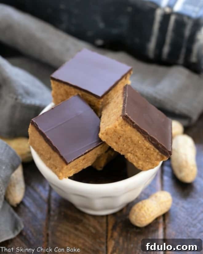 Better Than Reese's Bars - All the magnificent flavors of a Reese's peanut butter cup in a no-bake bar Better Than Reese's Peanut Butter Bars in a white bowl.