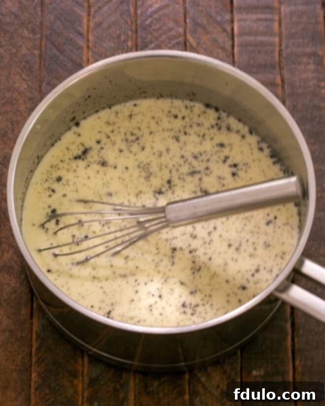 Heavenly Crème Brûlée Perfection 4 Saucepan with heated cream mixture, showing bubbles around the perimeter.