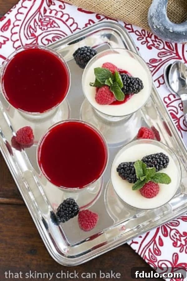 Overhead view of Vanilla Bean Panna Cotta, beautifully set in individual glasses on a silver tray, ready for serving.