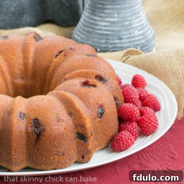 Raspberry Amaretto Bundt Cake | Pound cake full of fresh raspberries and flavored with extracts and liqueur