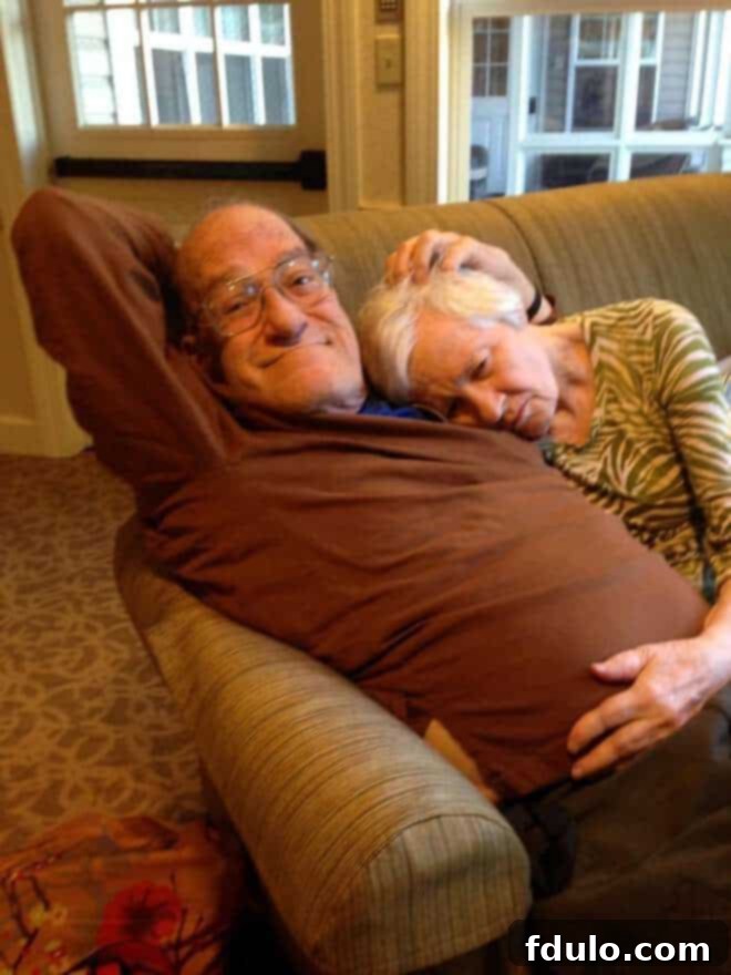 Mom snuggling with her true love, the author's dad, taken a week before her stroke, capturing a tender moment.