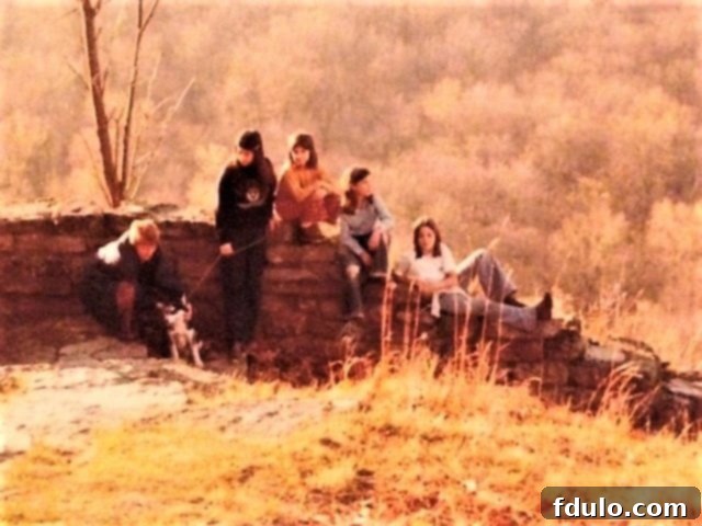 Family photo featuring Mom, her four daughters, and their new puppy Rufus, taken along the scenic Des Moines River.