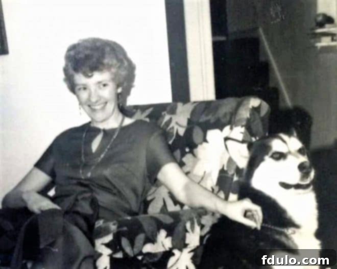 A beautiful portrait of Mom with her dog Rufus, showing her radiant smile and elegant demeanor.