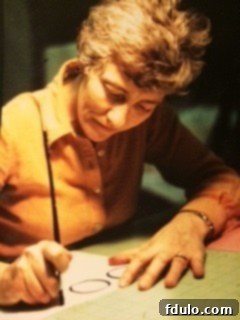 Mom intently working on her calligraphy, demonstrating her artistic talent and dedication.