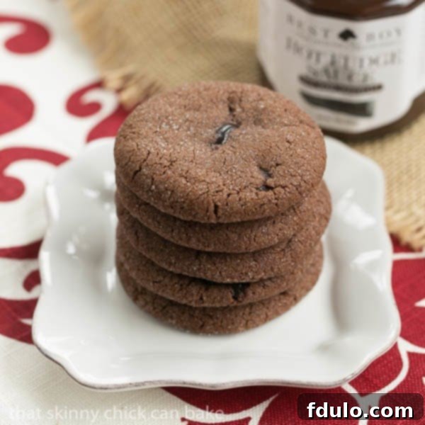 A beautifully arranged stack of dark, rich Chocolate Lava Cookies, hinting at their gooey centers, ready to be enjoyed.