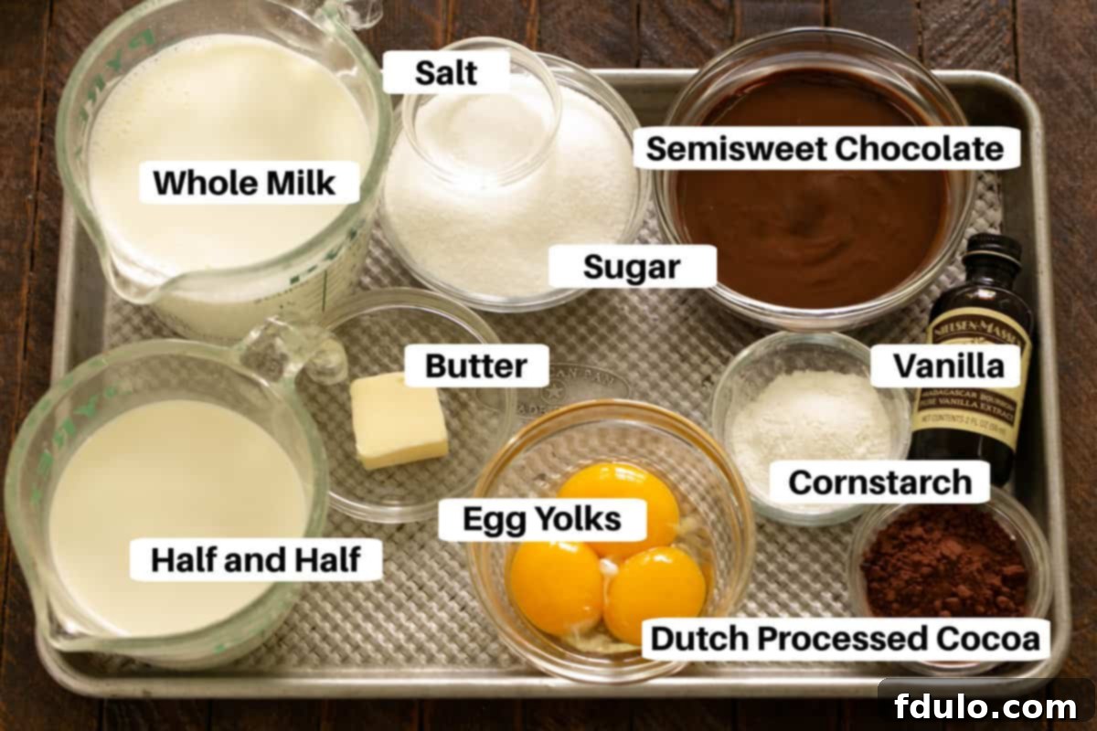 Clearly labeled ingredients for Double Chocolate Pudding laid out on a sheet pan, ready for preparation.