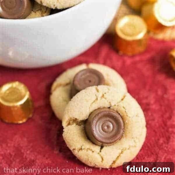 Rolo Peanut Blossoms on a vibrant red napkin, showcasing their golden-brown edges and melted Rolo centers.