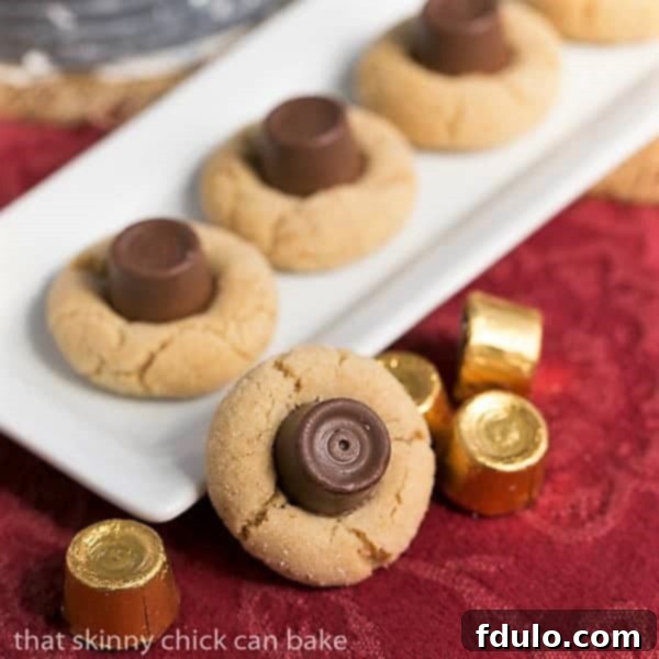 Peanut Butter Rolo Blossoms arranged on a pristine white ceramic tray, ready to be served.