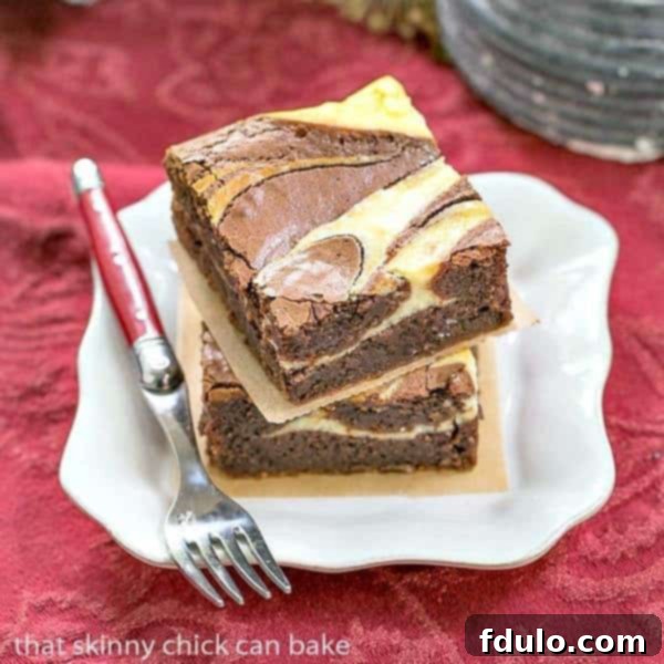 Stack of rich, fudgy Ricotta Cheesecake Brownies with a creamy swirl, ready to be enjoyed.