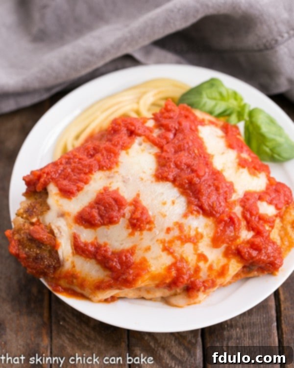 Homemade Chicken Parmesan - A terrific weeknight dinner of breaded chicken topped with cheese and marinara.