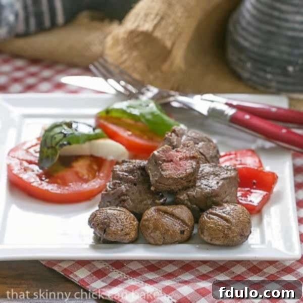 Tender Beef Steak Kabobs on a white plate