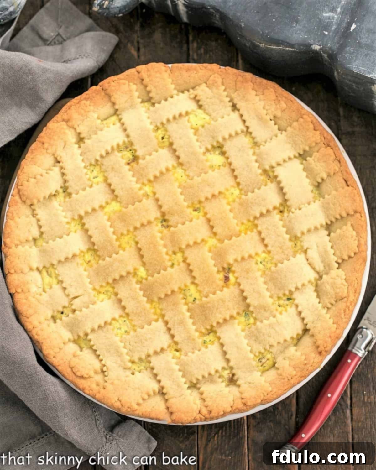 Overhead view of Pizza Rustica next to a red handled knife.