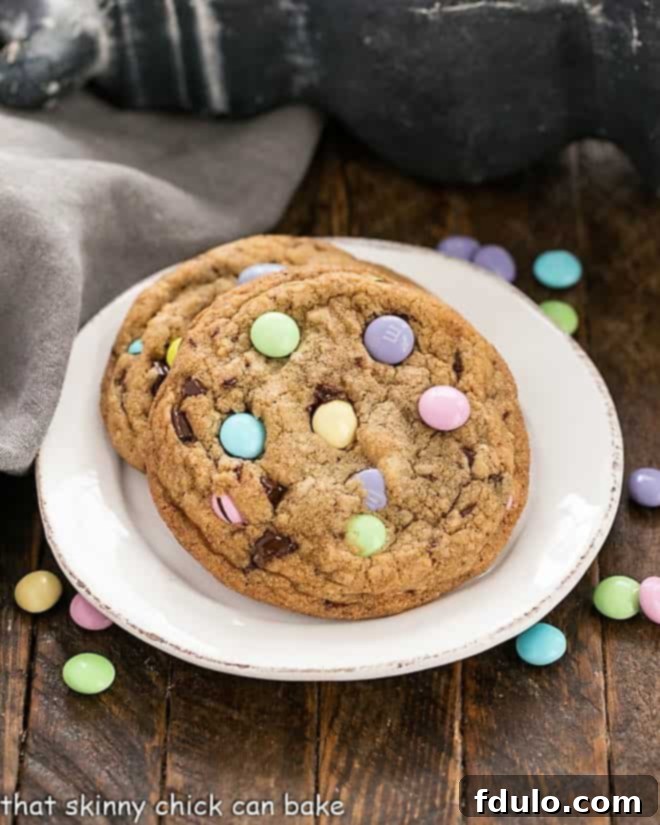 Nutty Brown Butter Easter Cookies 2 Two Brown Butter Easter Cookies with pastel M&M's on a white plate with a fork.