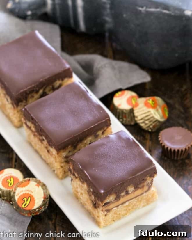 3 Stuffed Peanut Butter Rice Krispie Treats on a white ceramic tray