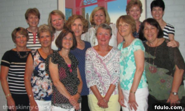 Velvet Chocolate Souffle Cake 3 A group of people enjoying a book club gathering, with a delicious Chocolate Souffle Cake on the table, symbolizing friendship and shared moments.