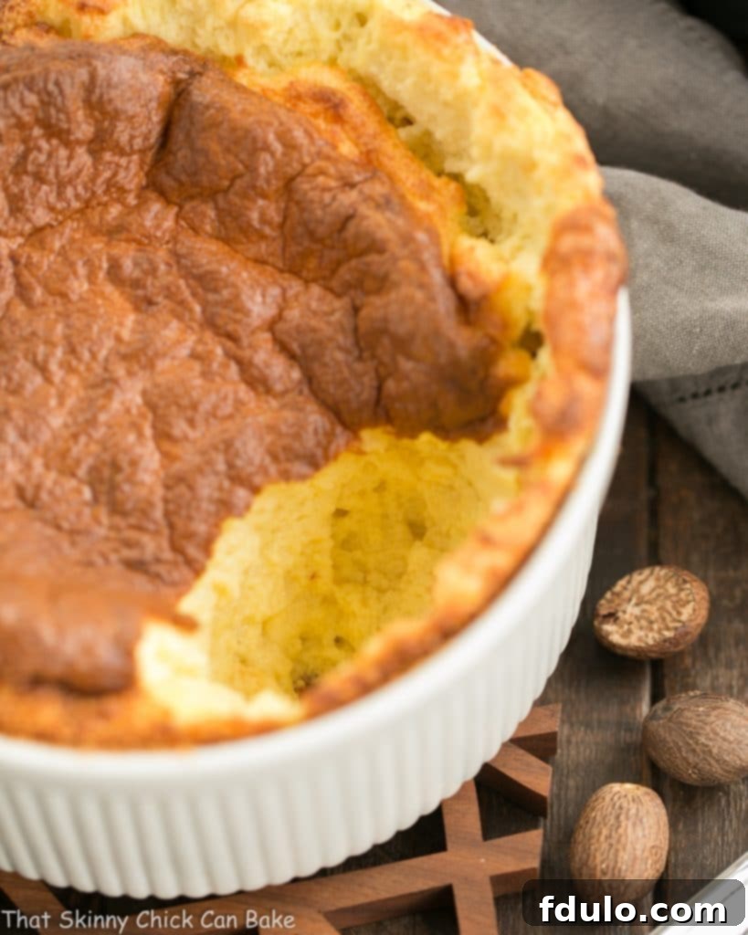 Close-up inside view of a French Gruyere Souffle, showing its airy, fluffy texture and melted cheese.