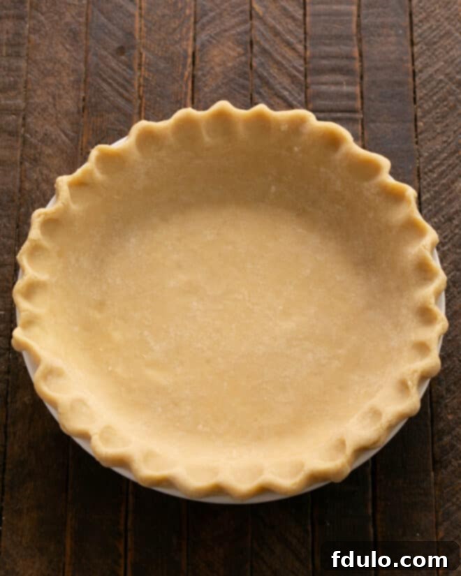 Traditional Dutch Apple Pie 3 Fit pie dough into pie plate and fllute the edges.