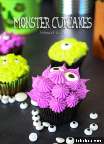 Adorable Monster Cupcakes with colorful frosting and candy eyes, a cute and sweet Halloween treat.