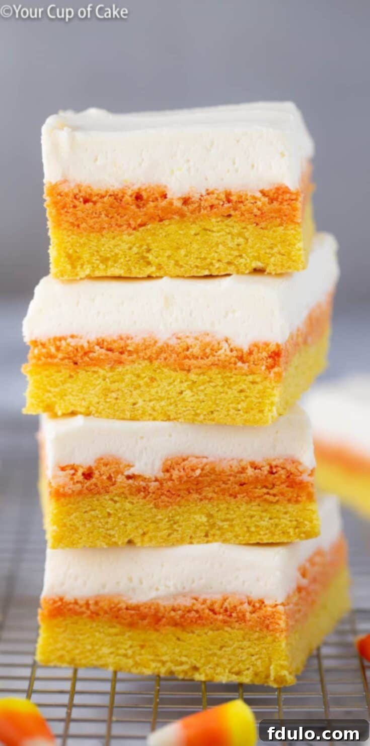 Candy Corn Sugar Cookie Bars, layered with the iconic colors of candy corn, a chewy and sweet Halloween dessert.
