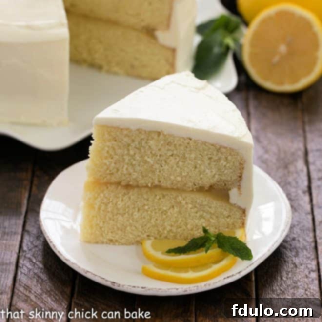 Lemon Layer Cake slice on a white dessert plate
