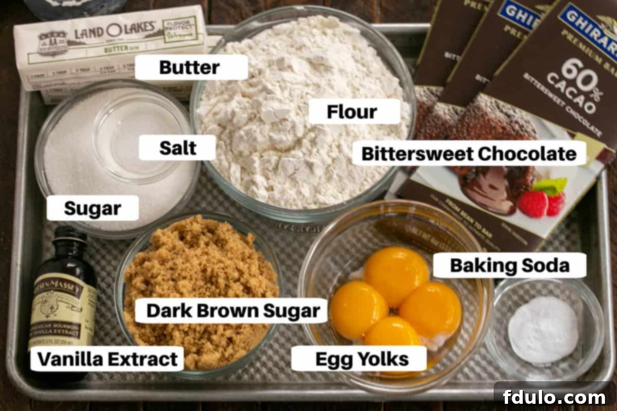 Layered Chocolate Chip Cookie Ingredients laid out on a sheet pan, ready for preparation.