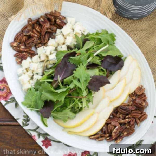 Blue Cheese and Pear Salad - A perfect fall or winter salad with candied pecans and a maple vinaigrette
